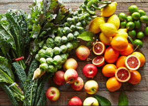 a group of fruits and vegetables on a wood surface Healthy Weight Loss Diets Cumbernauld