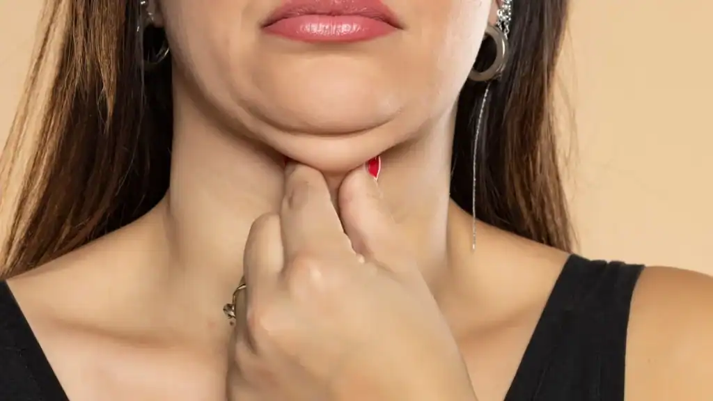 An image of a woman with double chin, sad, worried : Non Surgical Double Chin Removal Treatment in Cumbernauld, UK